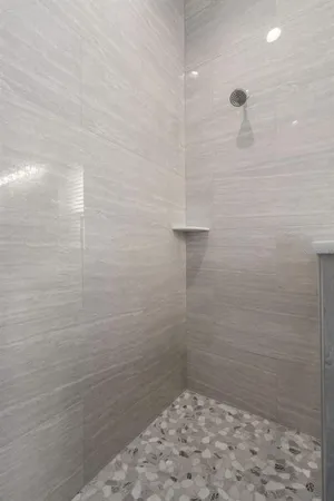 a view of a livingroom with a furniture and a ceiling fan