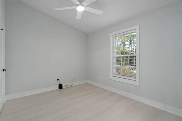 a view of a yard with trees