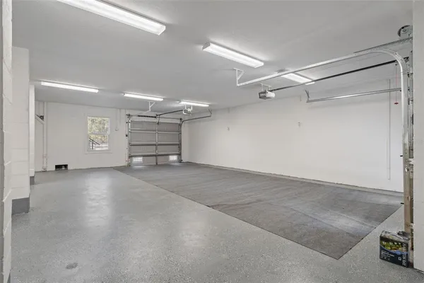 an aerial view of residential houses with outdoor and green space