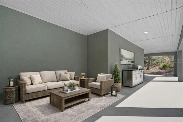 an aerial view of a house with swimming pool and wooden fence