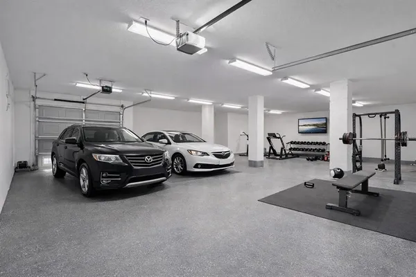 a aerial view of a house with a yard and large tree