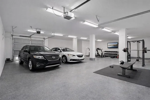 a aerial view of a house with a yard and large tree