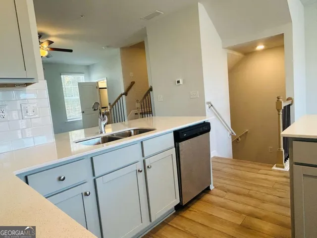 a bathroom with a sink and mirror