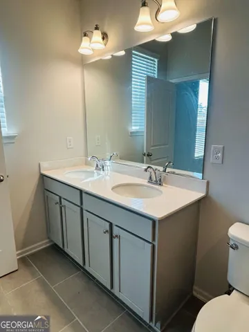 a view of a balcony with wooden benches and a floor to ceiling window
