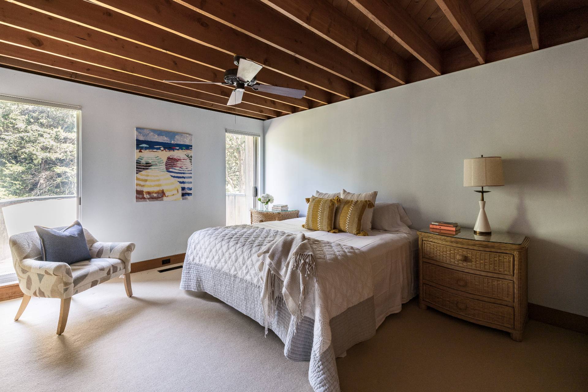 4 Baiting Hollow Road East Hampton, NY 11937 - Photo 15 of 30 a spacious bedroom with a bed next to a window