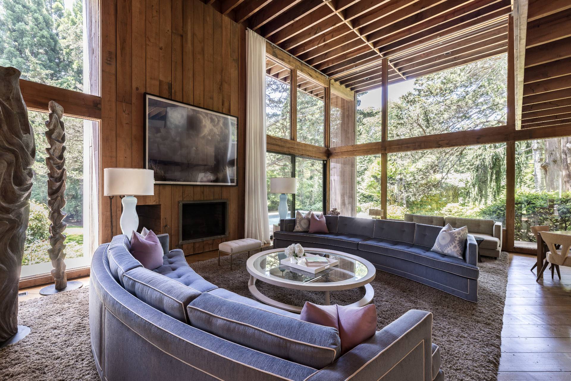4 Baiting Hollow Road East Hampton, NY 11937 - Photo 2 of 30 a living room with furniture a fireplace and a large window