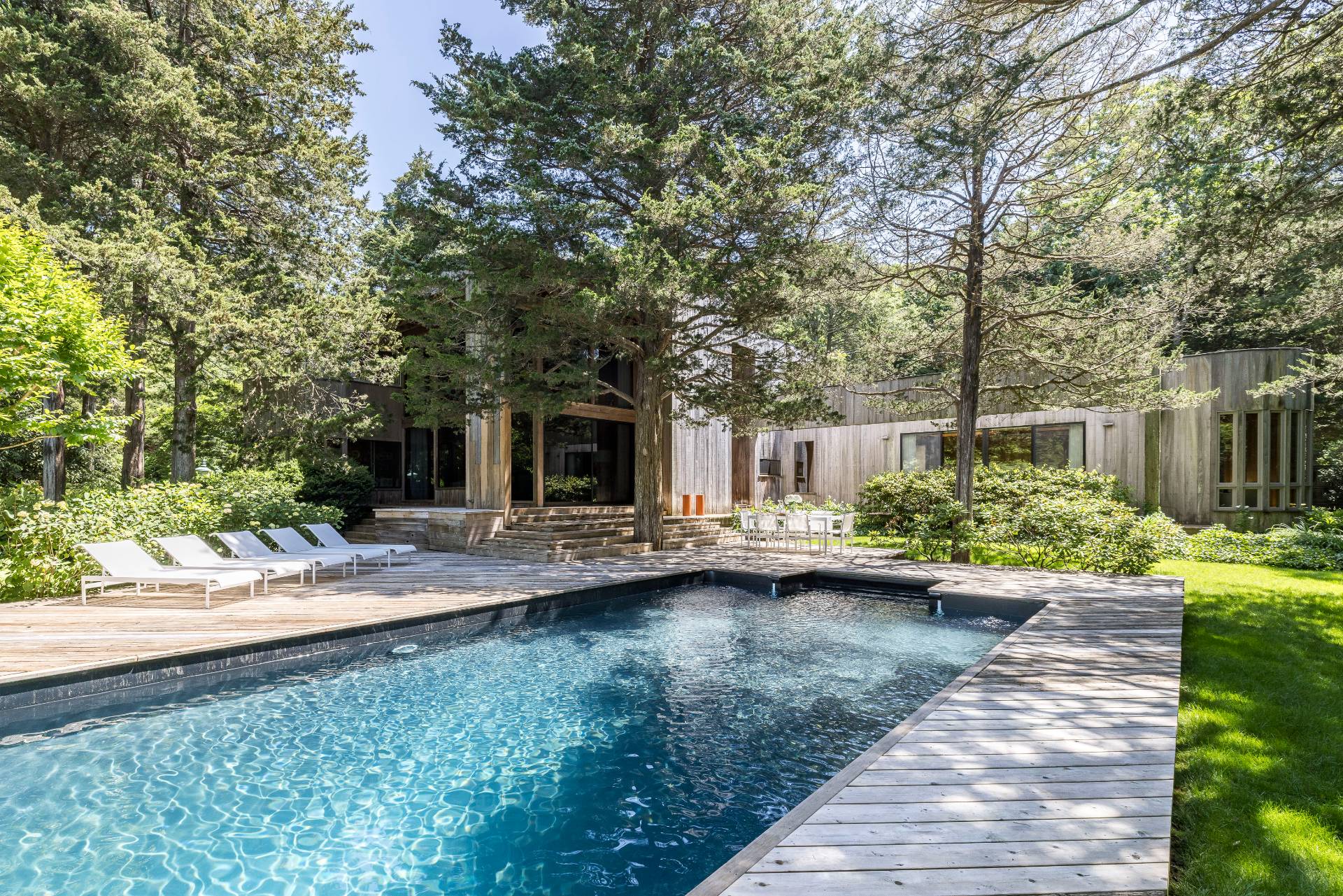 4 Baiting Hollow Road East Hampton, NY 11937 - Photo 21 of 30 a view of a house with patio and garden