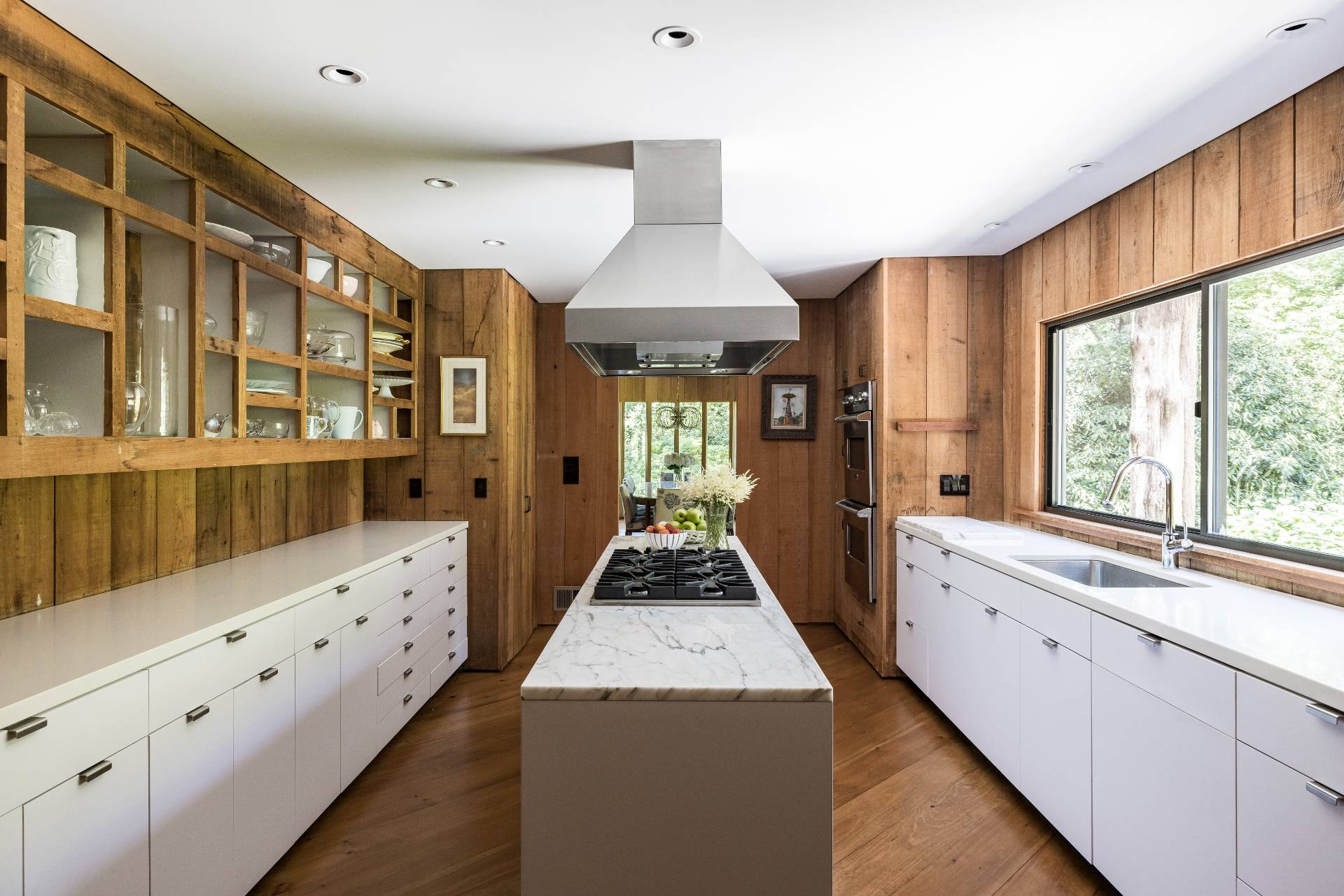 4 Baiting Hollow Road East Hampton, NY 11937 - Photo 8 of 30 a large kitchen with sink a refrigerator and wooden floor