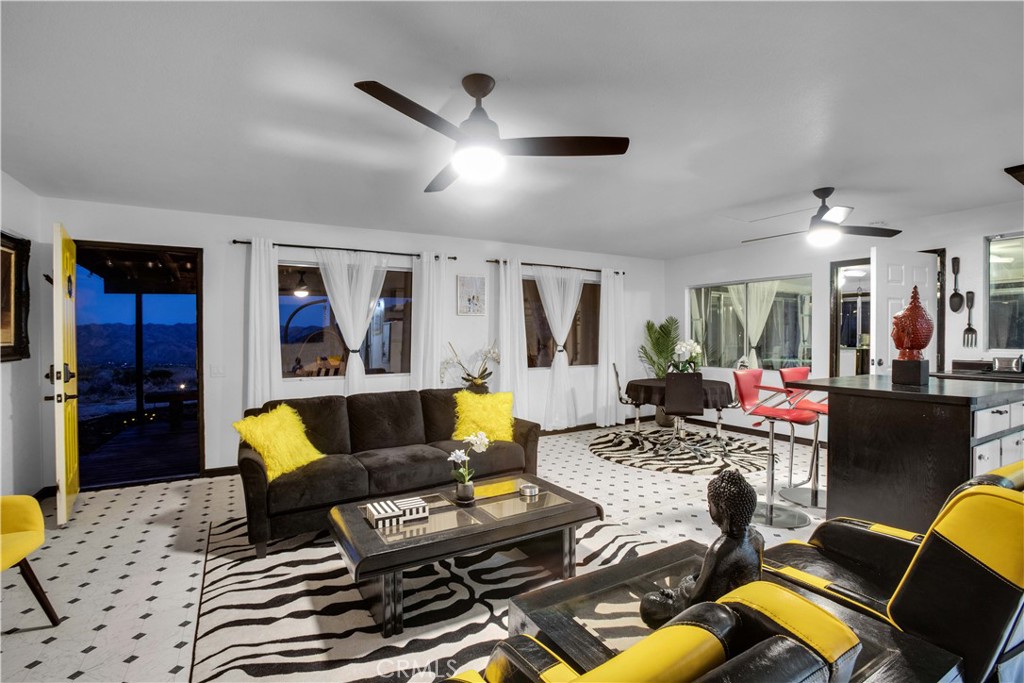 49490 Big Morongo Canyon Road Morongo Valley, CA 92256 - Photo 45 of 75 a living room with furniture and wooden floor