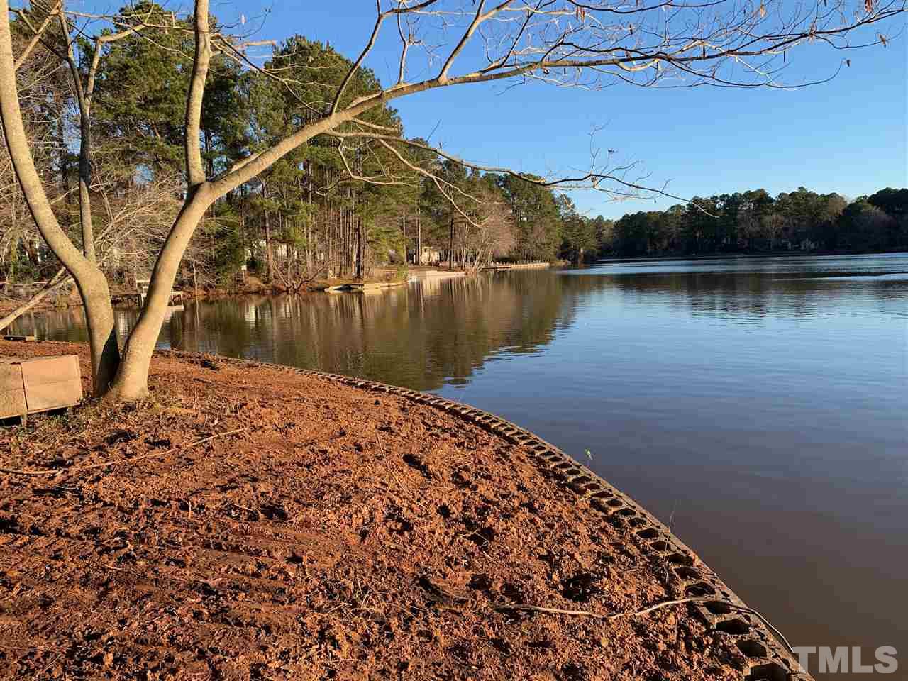 5509 Pelham Road Durham, NC 27713 - Photo 1 of 7 a view of a lake with a mountain in the background