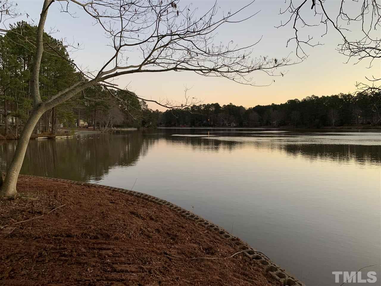 5509 Pelham Road Durham, NC 27713 - Photo 4 of 7 a view of a lake with a mountain