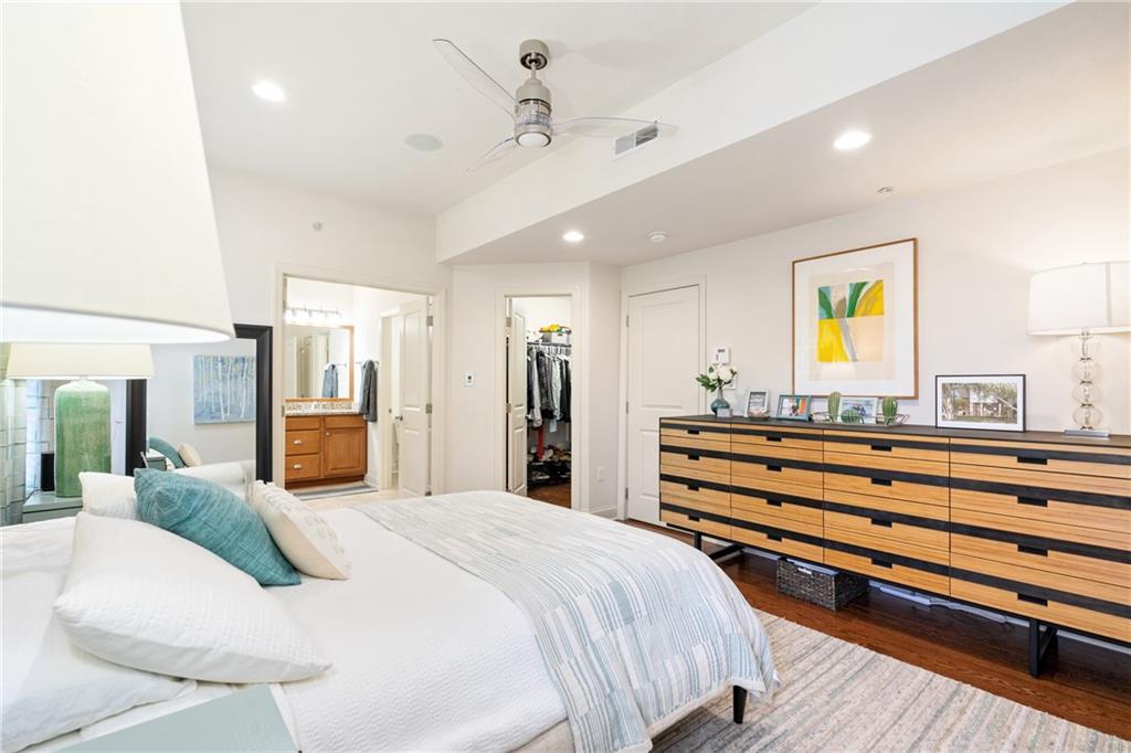 4709 Wallingford Street Pittsburgh, PA 15213 - Photo 14 of 24 a bedroom with a bed and a chandelier