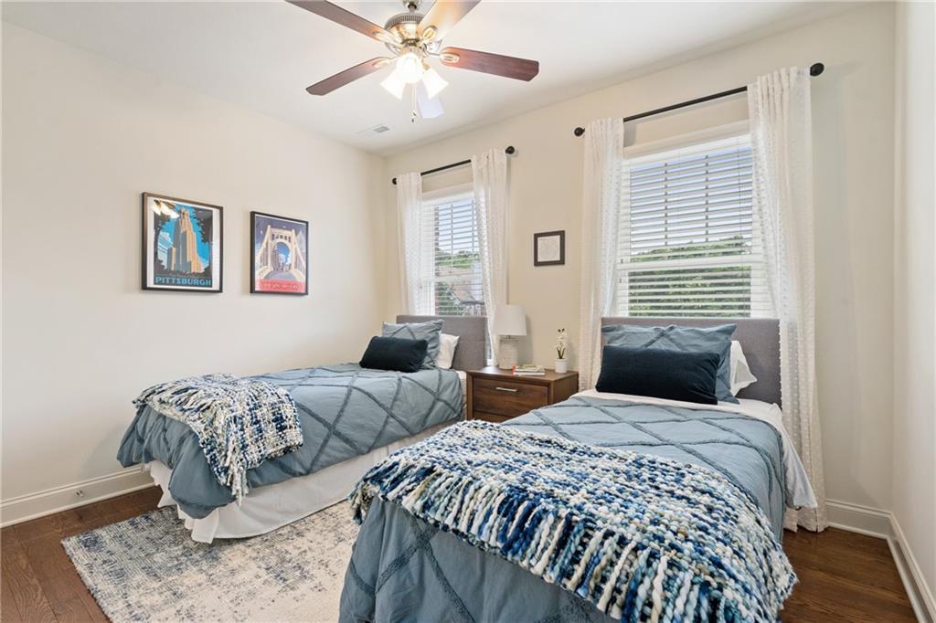4709 Wallingford Street Pittsburgh, PA 15213 - Photo 18 of 24 a bedroom with two large bed and a window