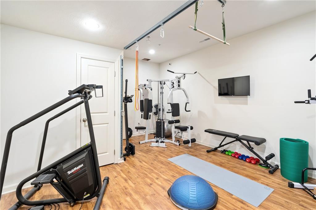 4709 Wallingford Street Pittsburgh, PA 15213 - Photo 24 of 24 a room with furniture and a flat screen tv