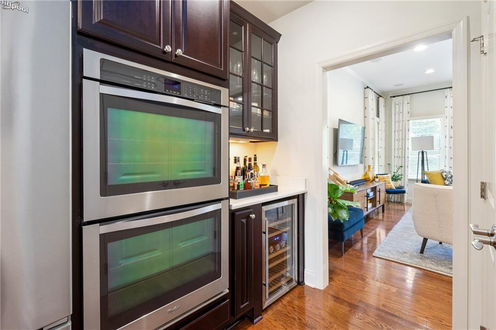 4709 Wallingford Street Pittsburgh, PA 15213 - Photo 10 of 24 a living room with fireplace furniture and a flat screen tv