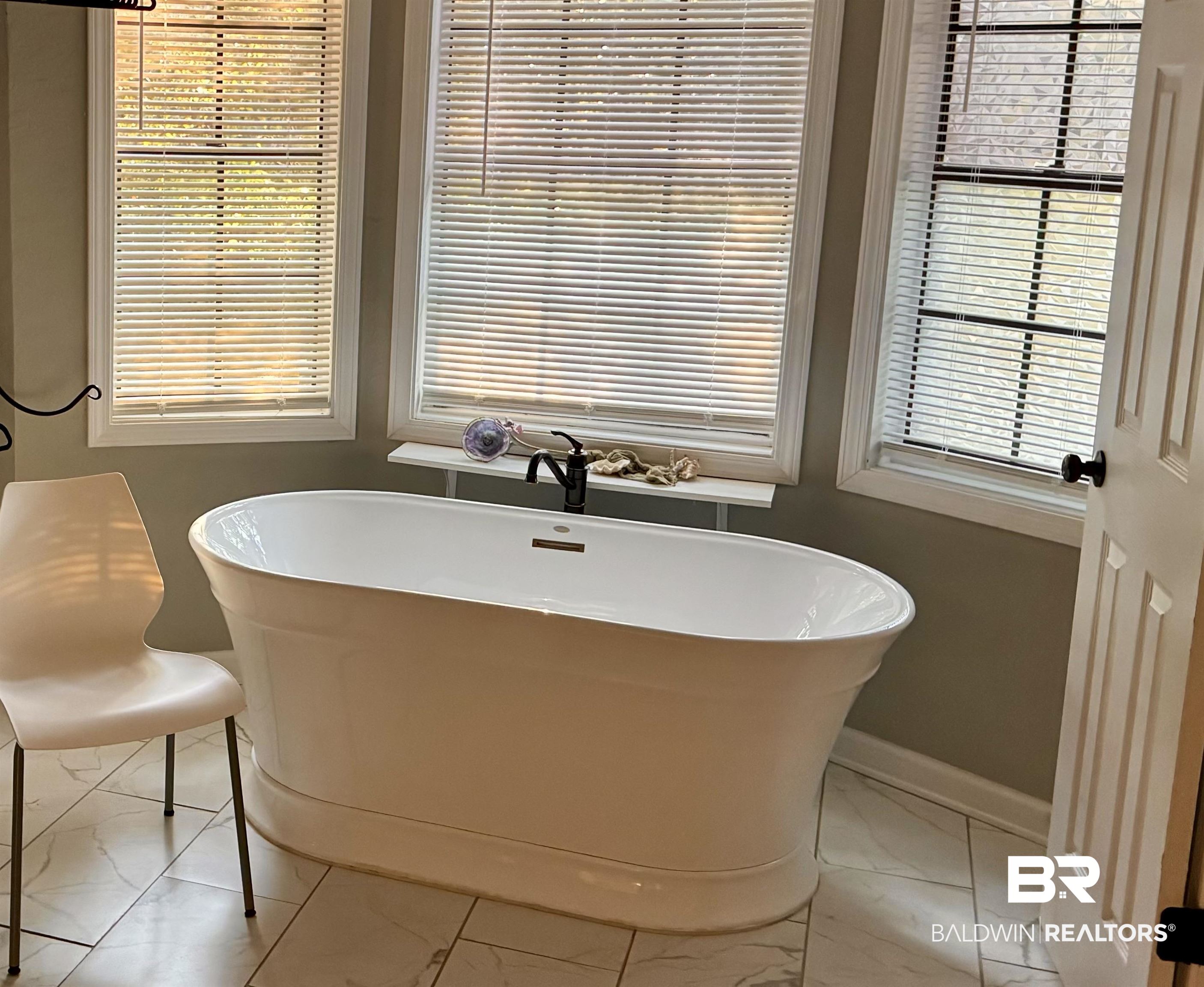 1302 Oak Street Daphne, AL 36526 - Photo 17 of 34 Full bath with a soaking tub and light marble finish floors