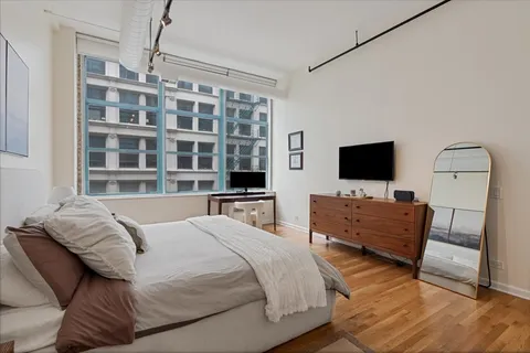 a bedroom with a bed and a view of bathroom