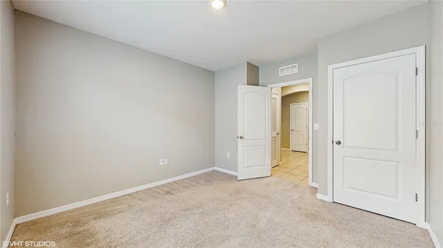 an empty room with closet area
