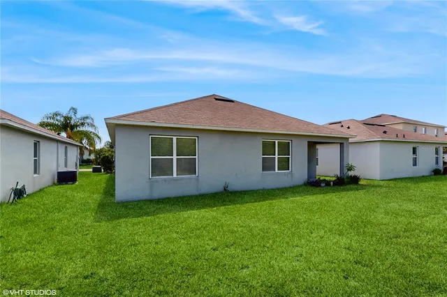 a view of a house with a yard