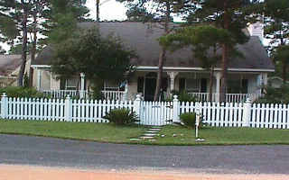 147 Bramble Street Santa Rosa Beach, FL 32459 - Photo 1 of 1 a front view of a house with a garden