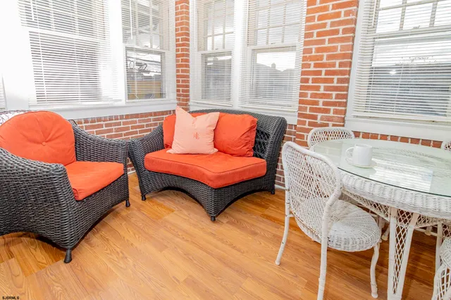 a bedroom with furniture and a large window