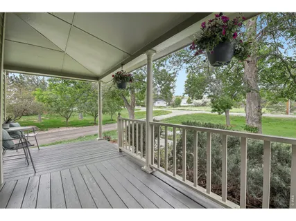 a view of balcony with wooden floor