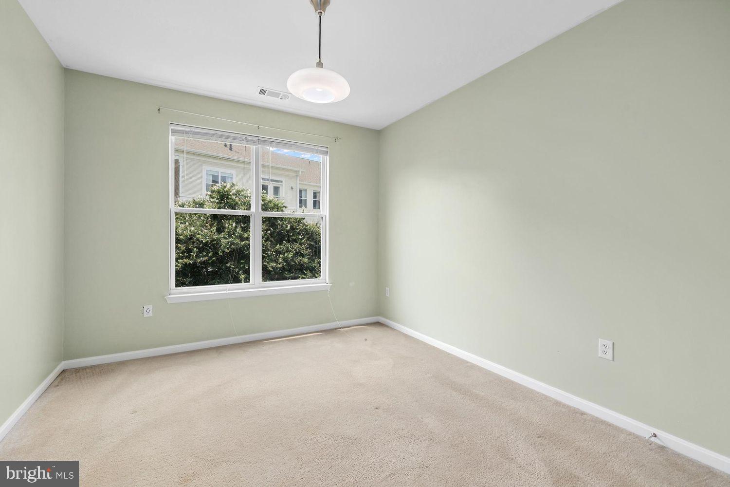 9480 Virginia Center Boulevard, Unit 329 Vienna, VA 22181 - Photo 11 of 30 a view of an empty room with a window