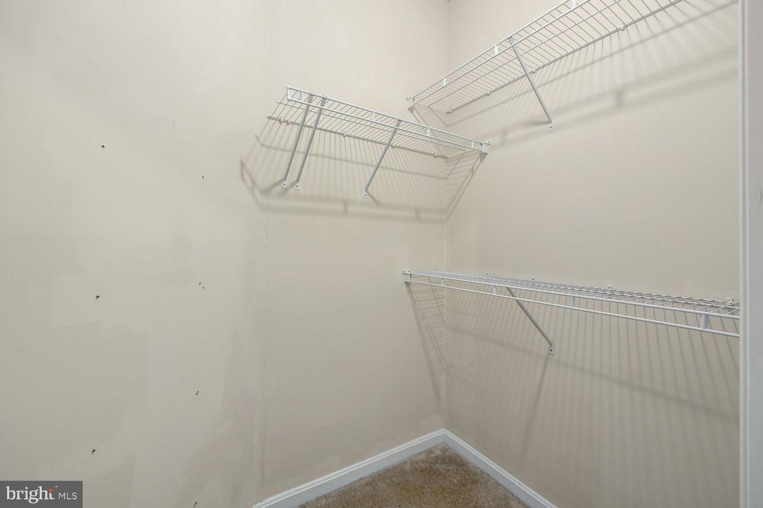 9480 Virginia Center Boulevard, Unit 329 Vienna, VA 22181 - Photo 12 of 30 a view of a room with racks on the wall