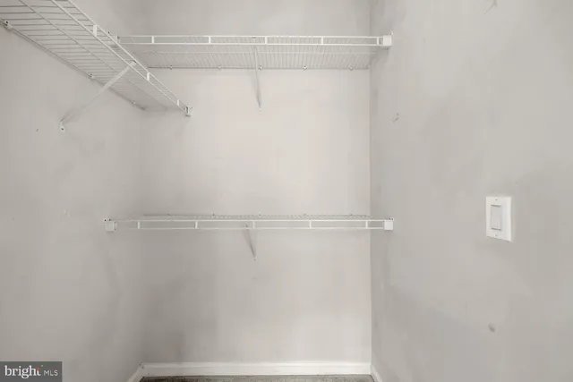 a view of a room with racks on the wall