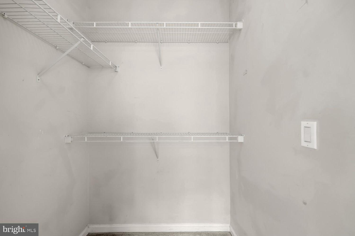 9480 Virginia Center Boulevard, Unit 329 Vienna, VA 22181 - Photo 17 of 30 a view of a room with racks on the wall