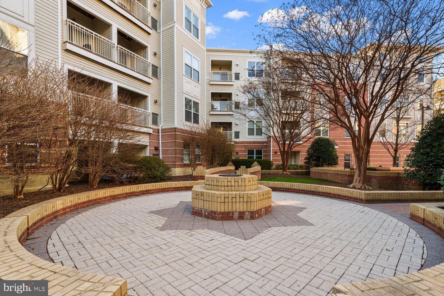 9480 Virginia Center Boulevard, Unit 329 Vienna, VA 22181 - Photo 27 of 30 a front view of a house with a yard
