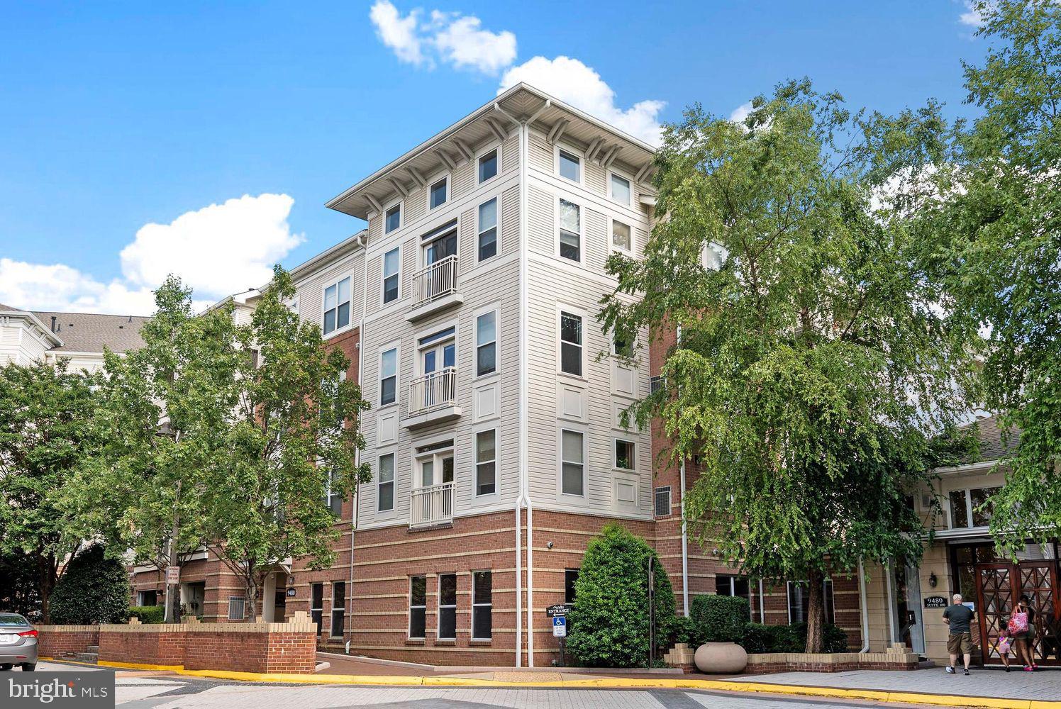 9480 Virginia Center Boulevard, Unit 329 Vienna, VA 22181 - Photo 29 of 30 a view of a tall building next to a road