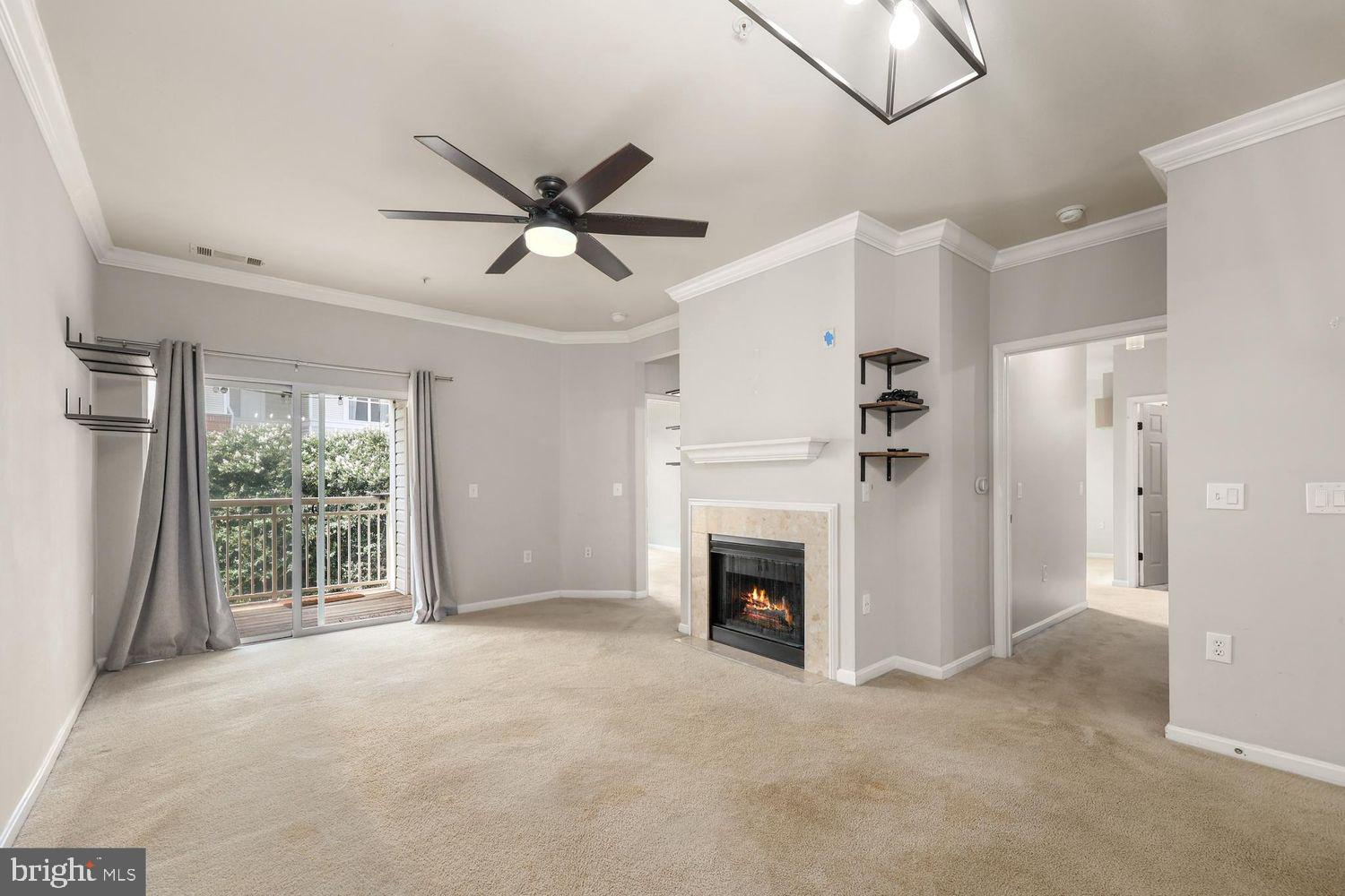 9480 Virginia Center Boulevard, Unit 329 Vienna, VA 22181 - Photo 8 of 30 a view of empty room with fan and windows