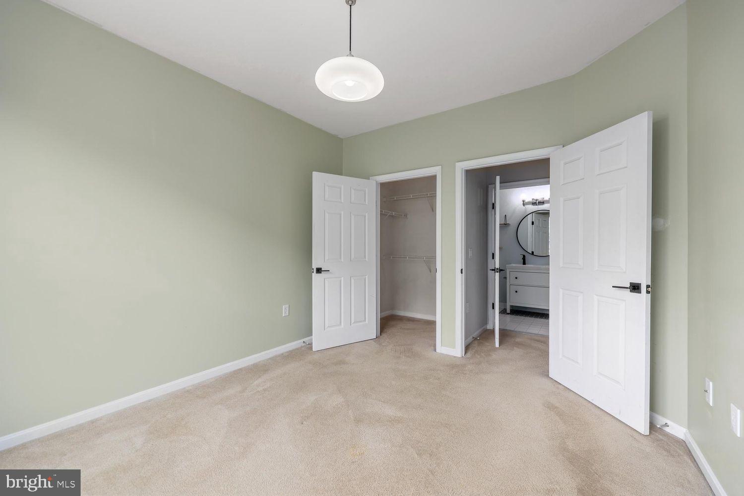 9480 Virginia Center Boulevard, Unit 329 Vienna, VA 22181 - Photo 10 of 30 a view of empty room with wooden floor