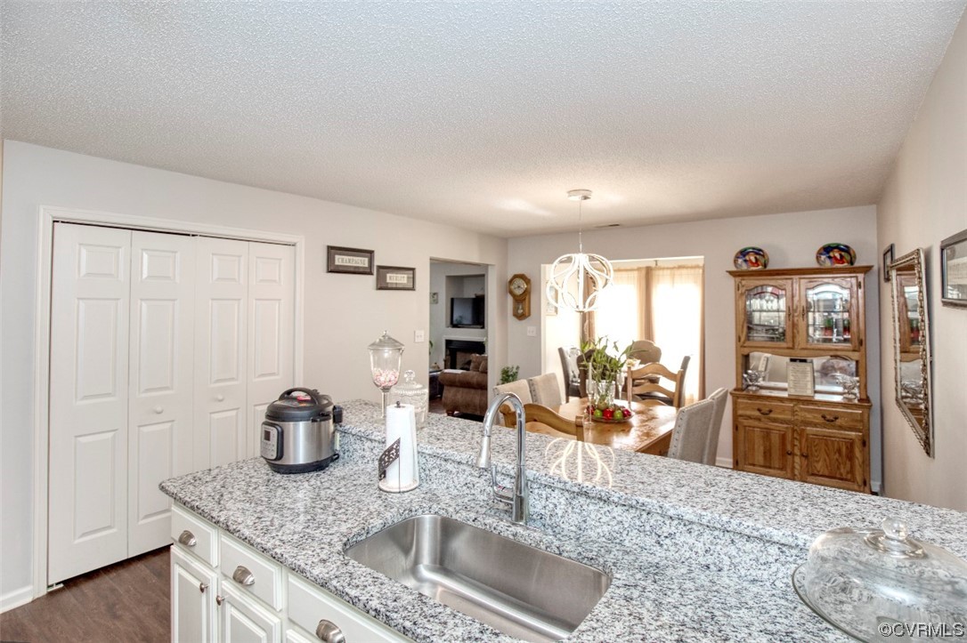 1403 Westgate Circle Williamsburg, VA 23185 - Photo 11 of 42 a kitchen with stainless steel appliances granite countertop a refrigerator and stove