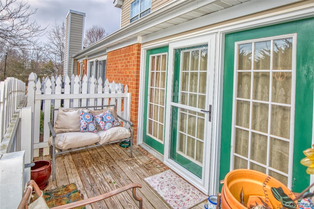 1403 Westgate Circle Williamsburg, VA 23185 - Photo 17 of 42 a view of a balcony with chair and the potted plant