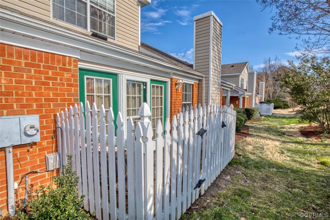 1403 Westgate Circle Williamsburg, VA 23185 - Photo 18 of 42 a front view of a house with a yard