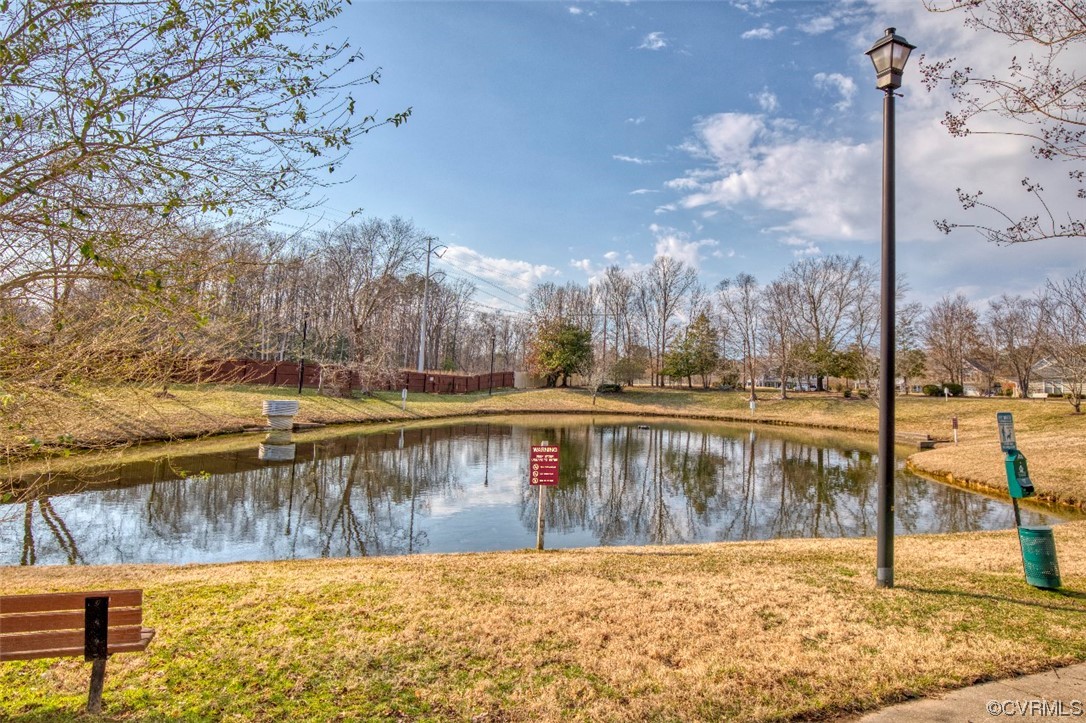 1403 Westgate Circle Williamsburg, VA 23185 - Photo 2 of 42 a view of a lake with a yard