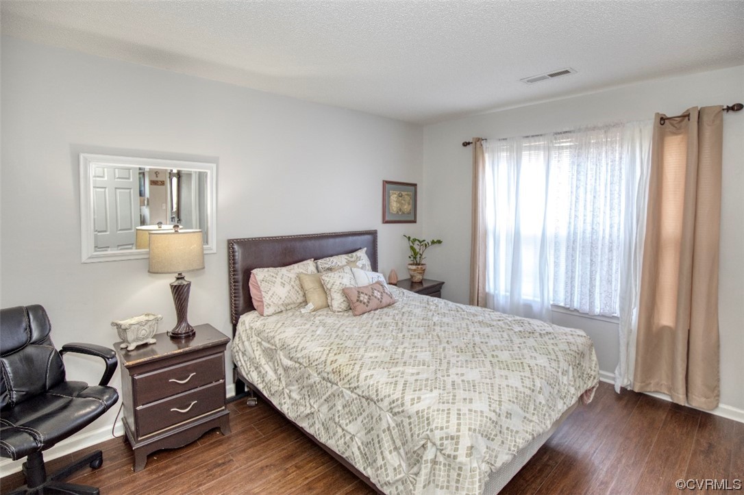 1403 Westgate Circle Williamsburg, VA 23185 - Photo 21 of 42 a bedroom with a bed and wooden floor