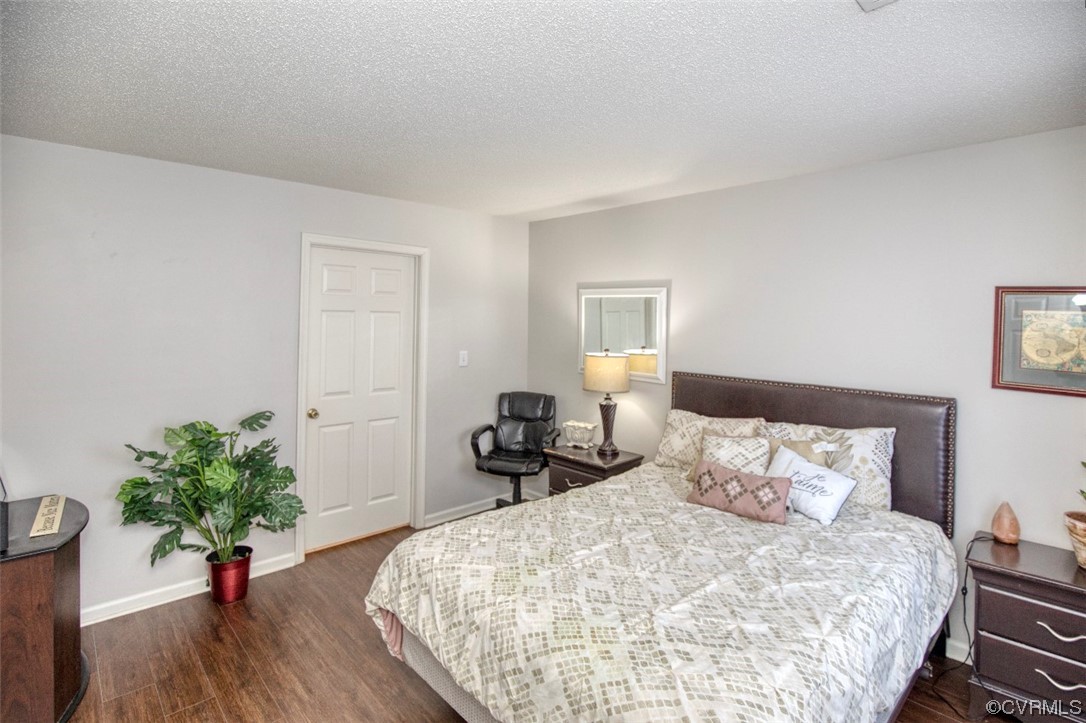 1403 Westgate Circle Williamsburg, VA 23185 - Photo 23 of 42 a bedroom with bed and wooden floor