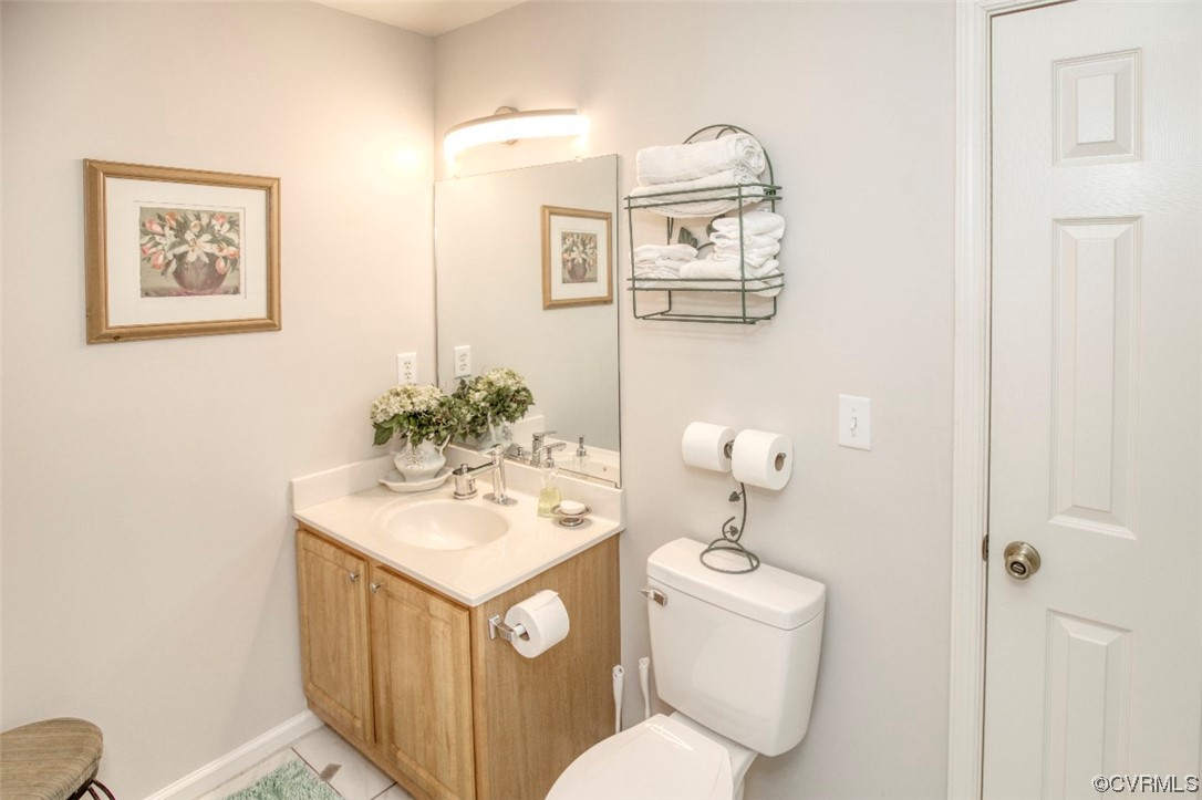 1403 Westgate Circle Williamsburg, VA 23185 - Photo 27 of 42 a bathroom with a toilet sink and mirror