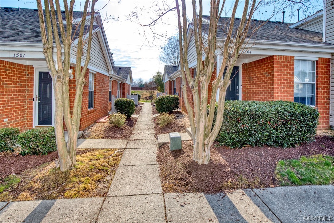1403 Westgate Circle Williamsburg, VA 23185 - Photo 3 of 42 a view of a pathway with a house
