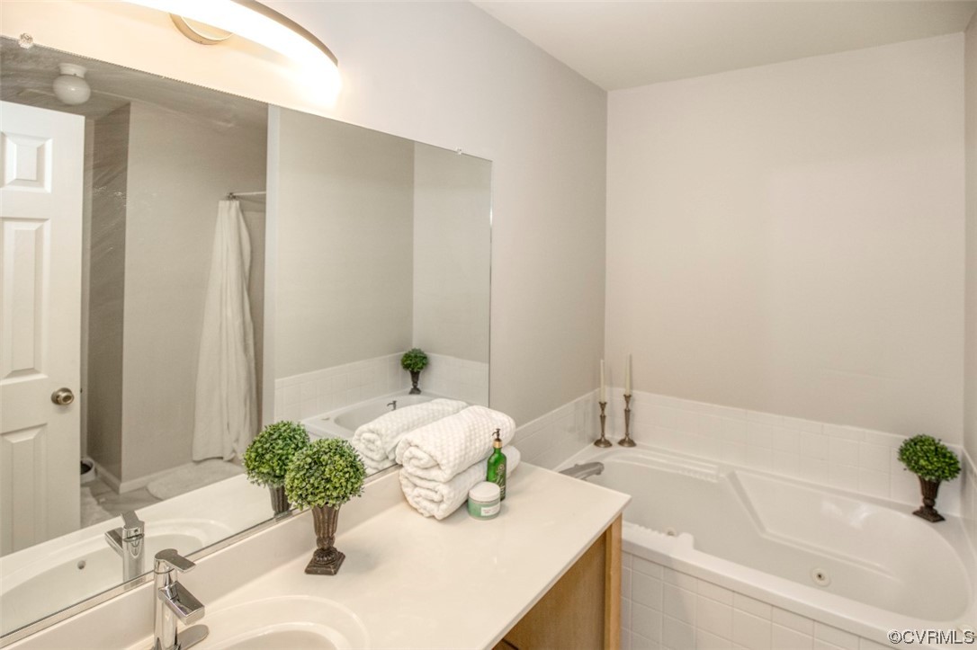 1403 Westgate Circle Williamsburg, VA 23185 - Photo 35 of 42 a bath room with a sink and a mirror