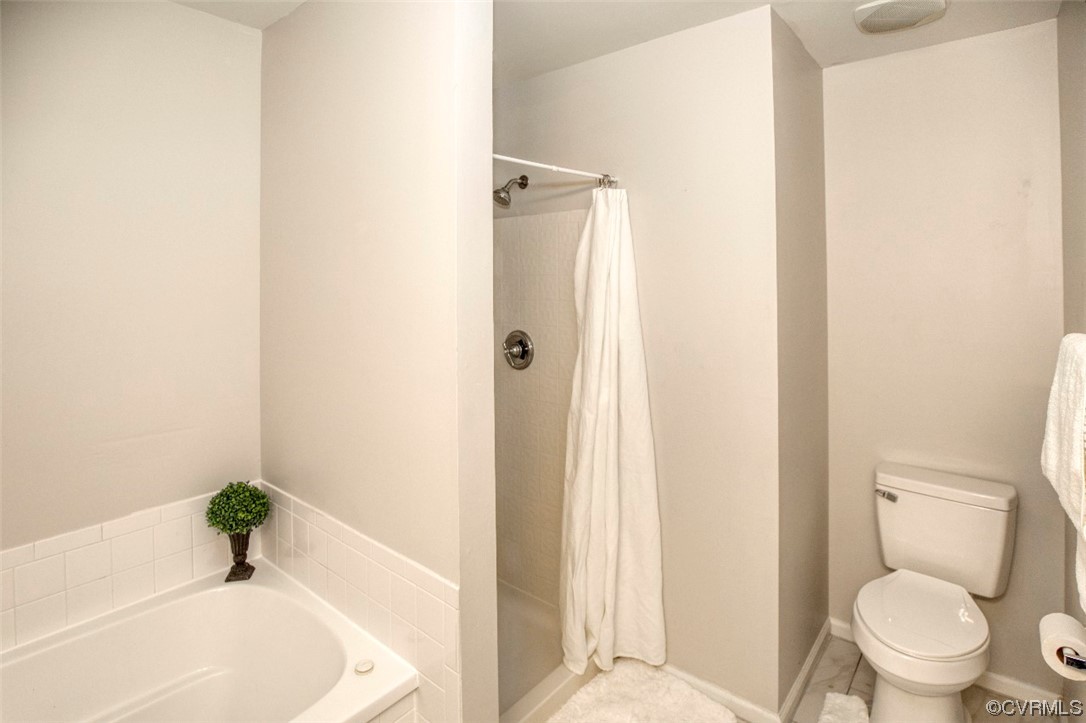 1403 Westgate Circle Williamsburg, VA 23185 - Photo 37 of 42 a white toilet sitting next to a bath tub