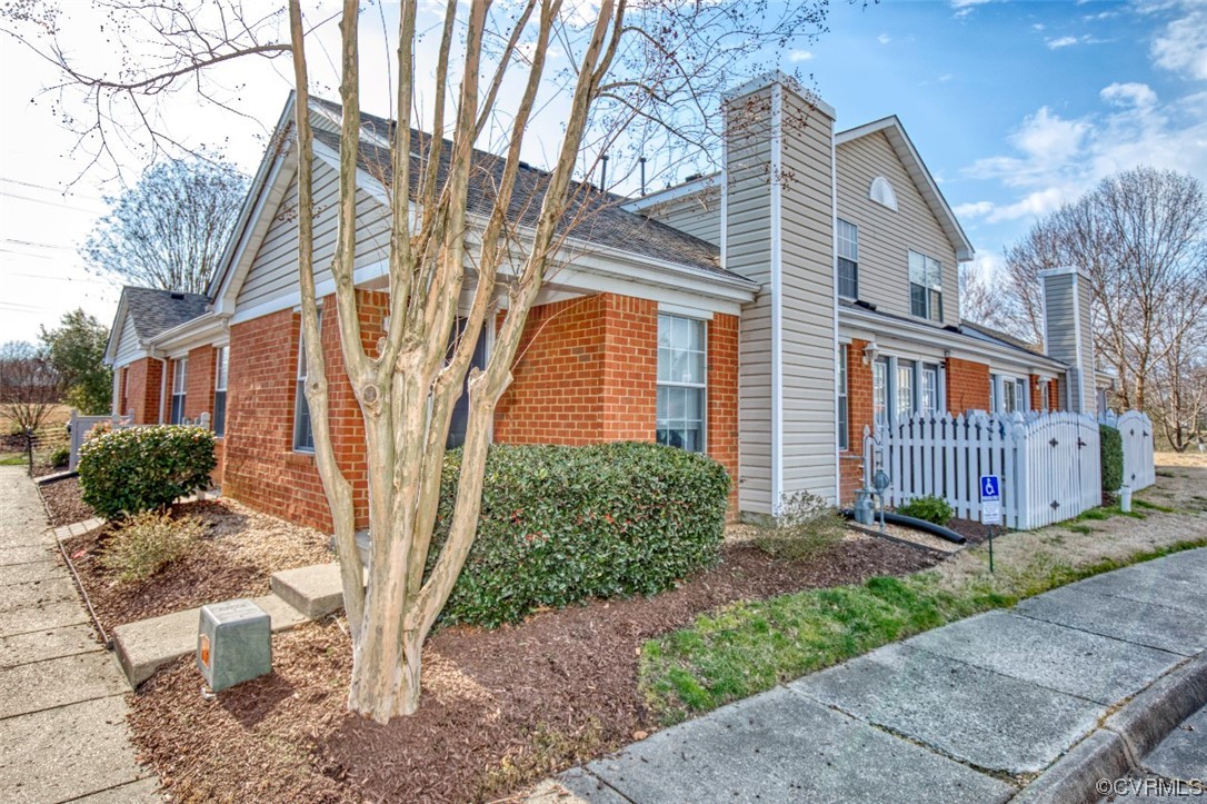 1403 Westgate Circle Williamsburg, VA 23185 - Photo 4 of 42 a front view of a house with garden