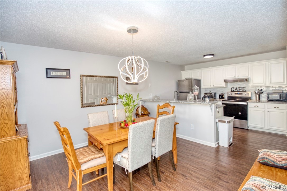 1403 Westgate Circle Williamsburg, VA 23185 - Photo 9 of 42 a dining room with furniture and wooden floor
