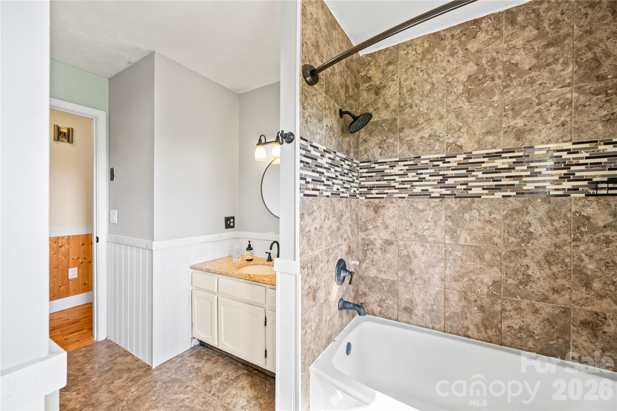 882 Queentown Road Canton, NC 28716 - Photo 15 of 33 a bathroom with a bathtub and a shower