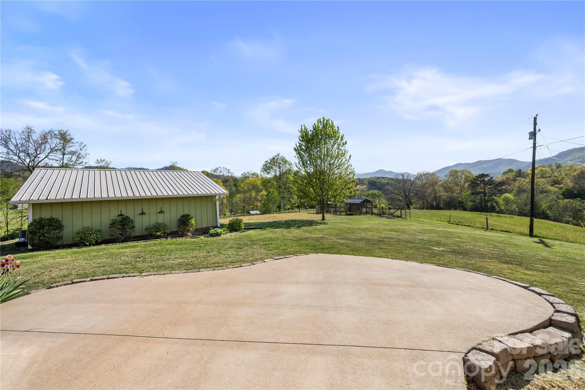 882 Queentown Road Canton, NC 28716 - Photo 29 of 33 a view of a house with a big yard and potted plants