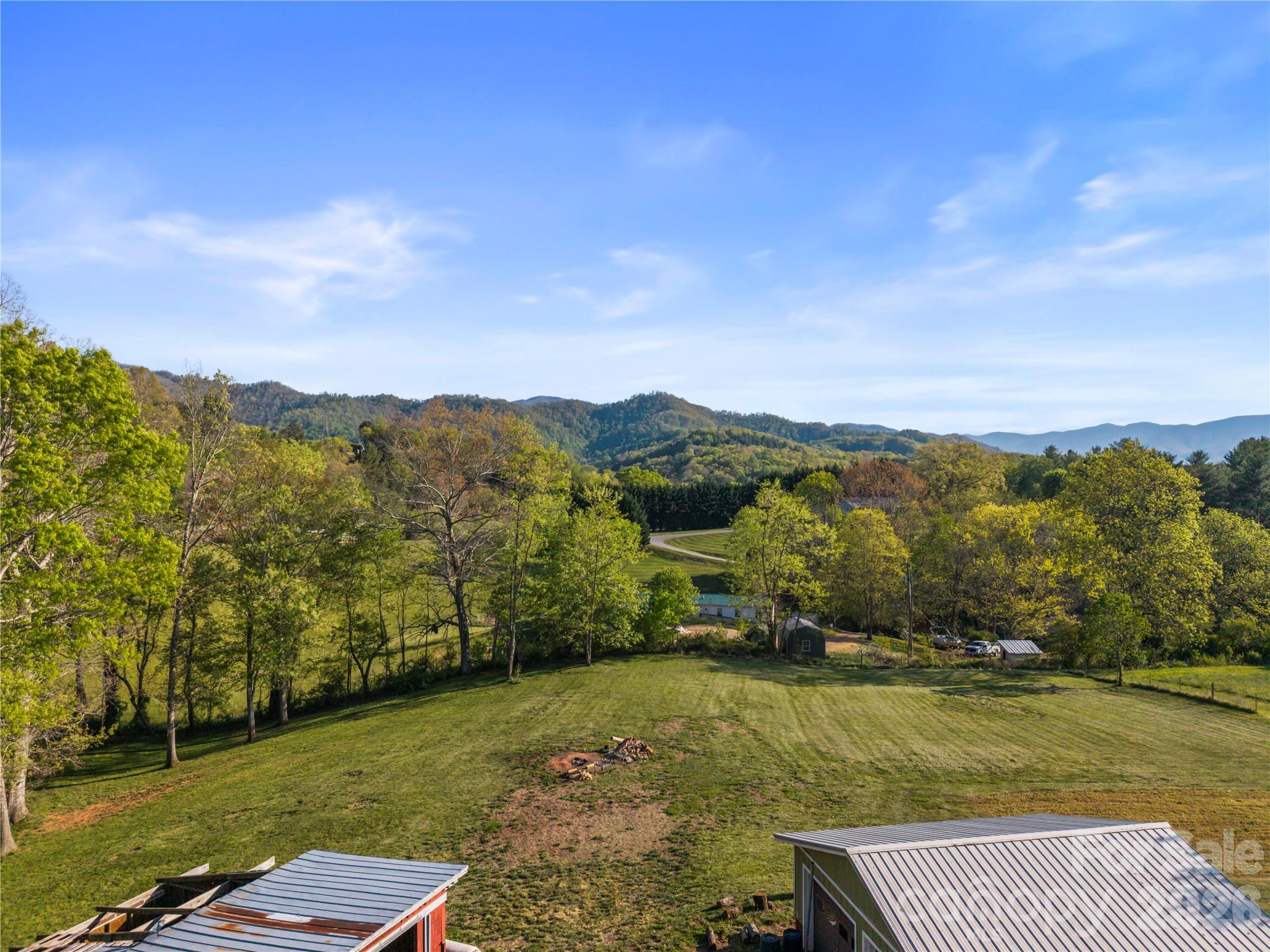 882 Queentown Road Canton, NC 28716 - Photo 32 of 33 a view of a lake with a mountain