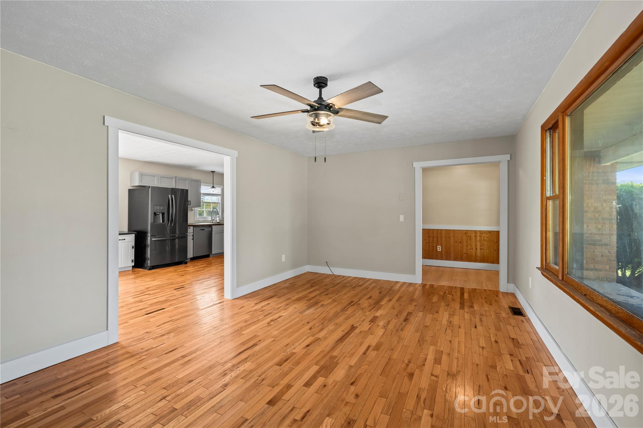 882 Queentown Road Canton, NC 28716 - Photo 9 of 33 wooden floor in an empty room with a window